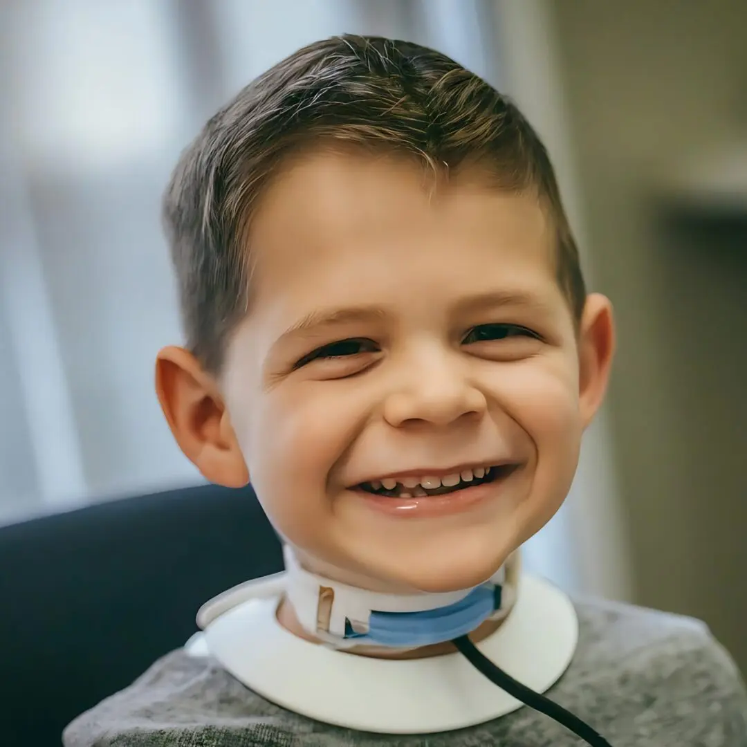 Smiling,Little,Boy,On,Tracheostomy,Tube,Through,Neck